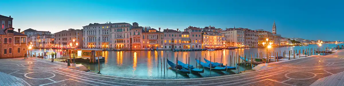 Panoramic photo of the evening Grand Canal in spring Venice.