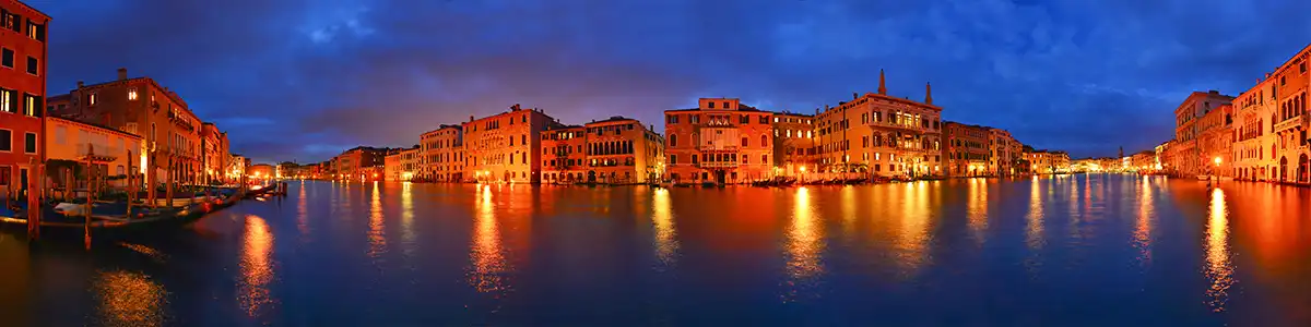 Panoramic photo of the evening Grand Canal in spring Venice.