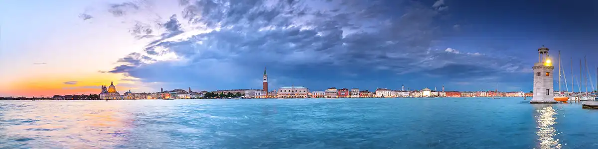 Panoramic photo of approaching spring thunderstorm to evening Venice.