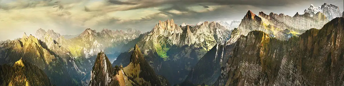 Panoramic photo of sunset mountains in autumn Switzerland.
