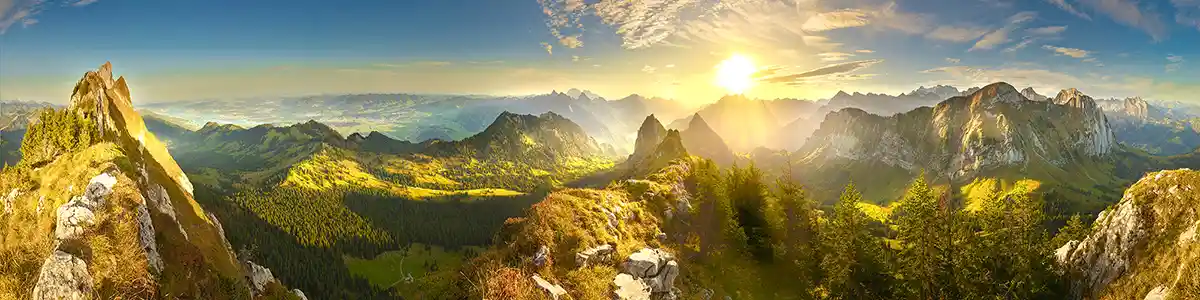 Panoramic photo of sunrise mountains in autumn Switzerland.