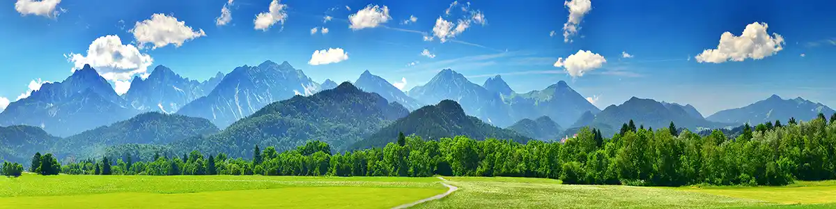 Panoramic photo of mountains in summer Bavaria.