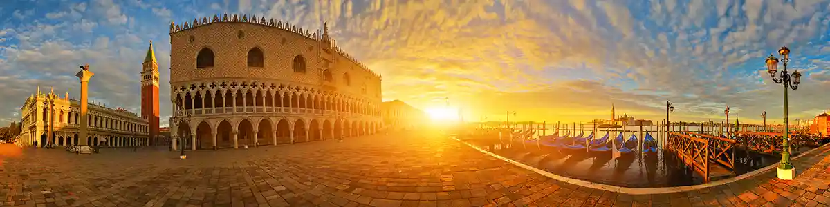 Panoramic photo of sunrise on St Mark's square in spring Venice.