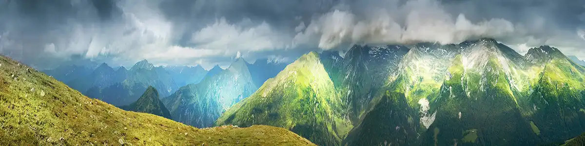Panoramic photo of summer mountains above the Brenner Pass.