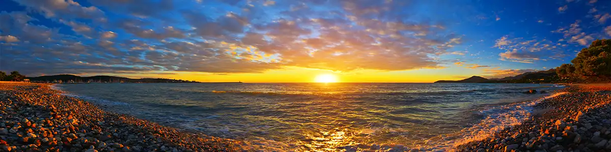 Panoramic photo of sunset over the Adriatic Sea in Montenegro.